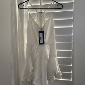 Small crème color short romper. Brand new.